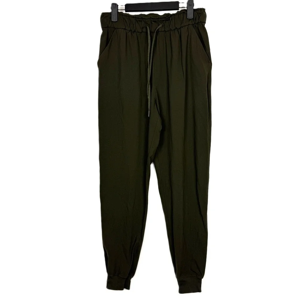 Lululemon On The Fly Jogger Dark‎ Olive Green Elastic Waist Size 8 FLAWED